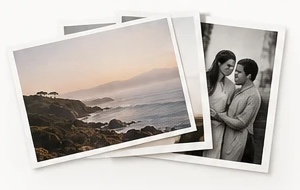 Three photo prints laid on top of each other: a coastline, and a couple embracing